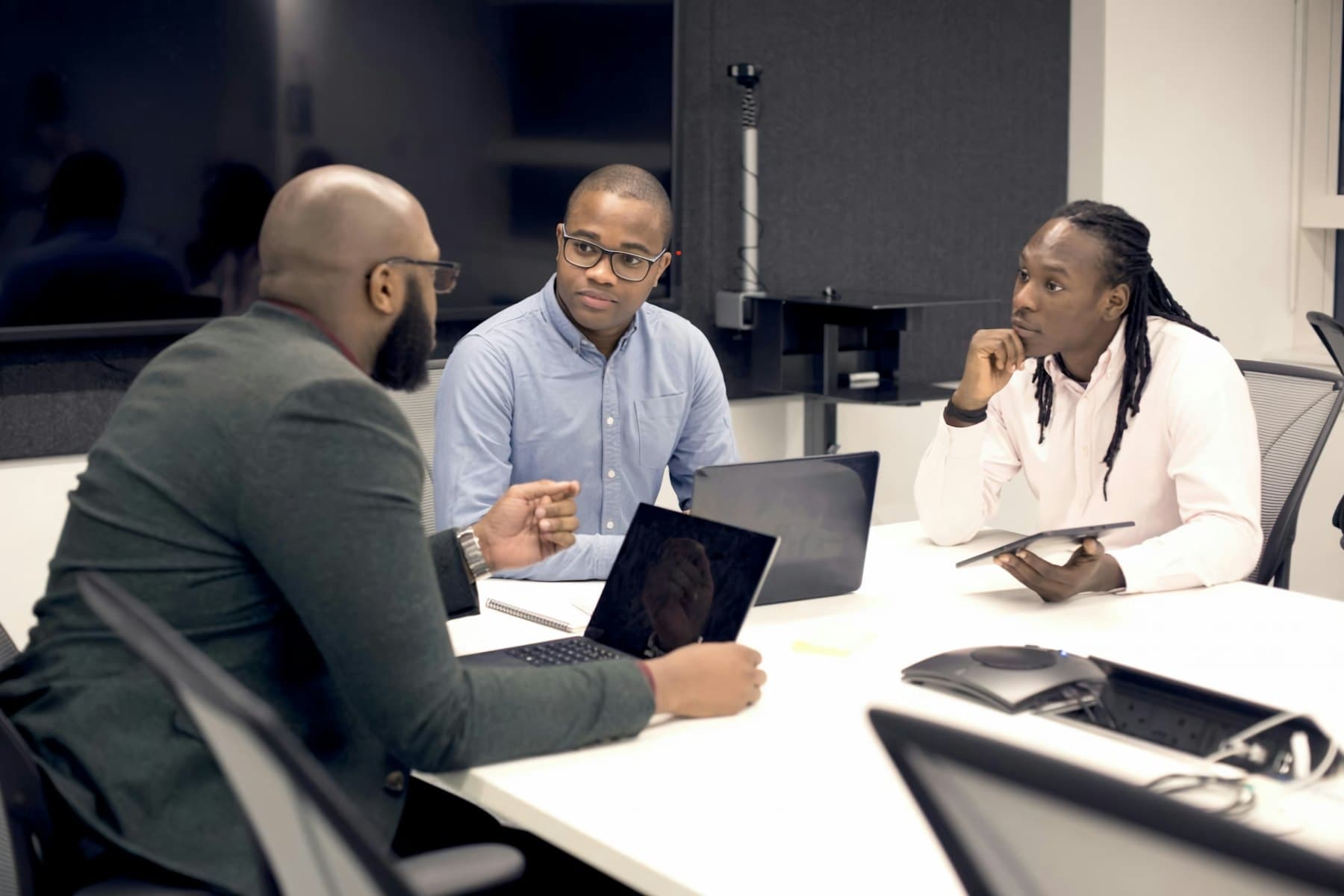 Physician committee meeting around a table